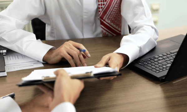 arab-man-reviews-document-office_1244325-84 الاستشارات والدراسات الإدارية