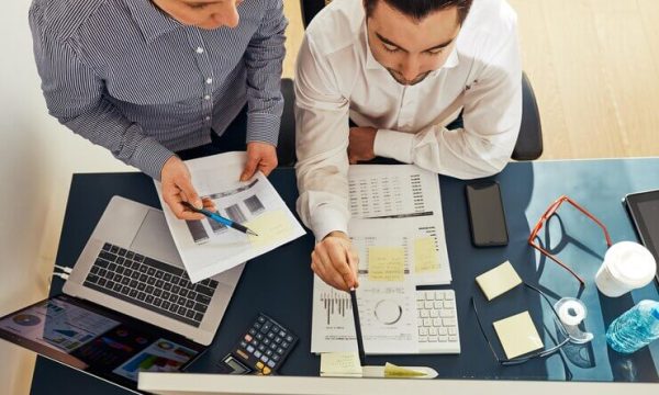 business-people-discussing-data-screen-people-using-technology-co-working-employees-teamwork_1048944-14229292 الاستشارات الضريبية